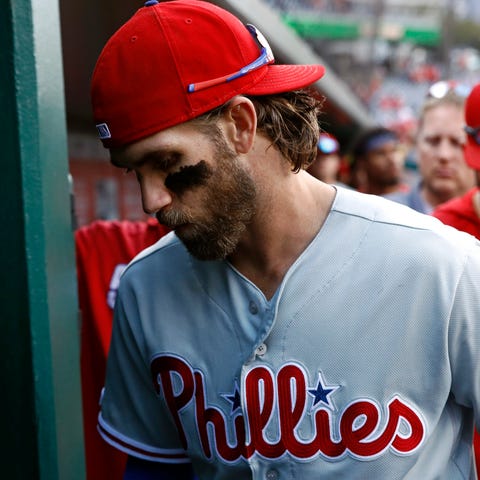 Bryce Harper leaves the dugout after the Phillies'