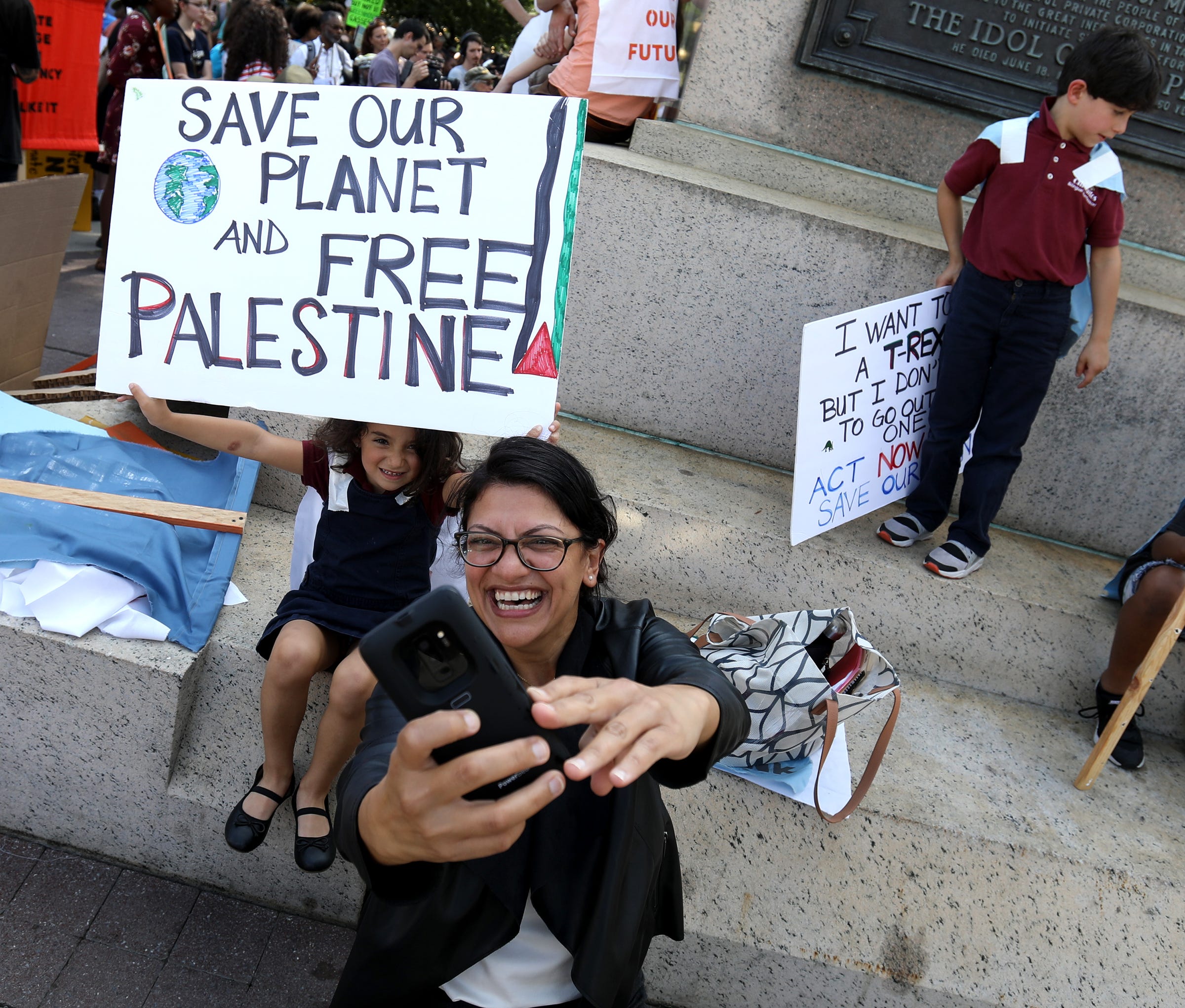 Rep. Rashida Tlaib takes a selfie with Mayaar Arraf-Shapiro 4, at Grand Circus Park during the climate strike and protest in Detroit.