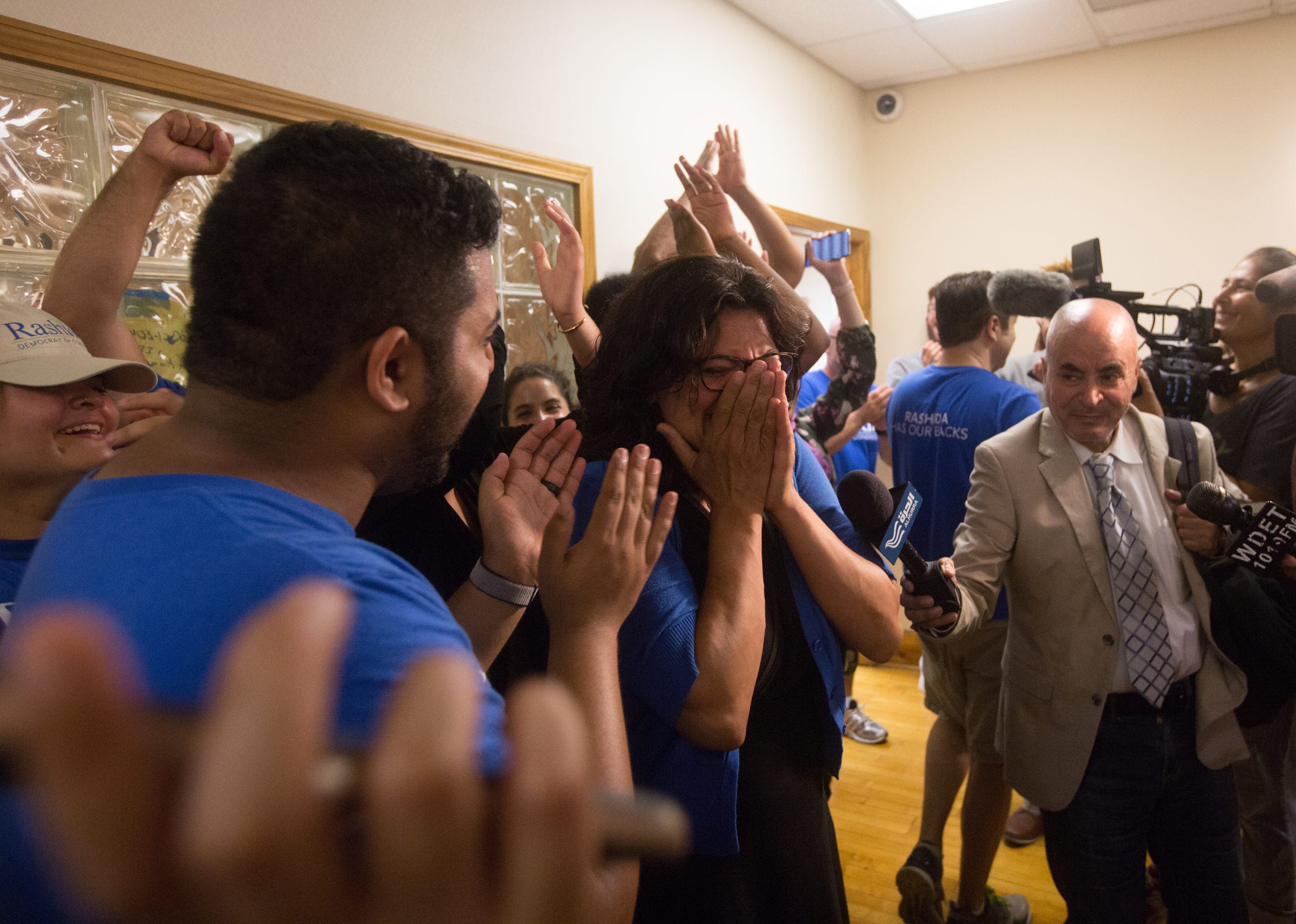 Rashida Tlaib celebrates at one of Tlaib's field offices in northwest Detroit after winning the Democratic primary in Michigan's 13th District  on Aug. 7, 2018.