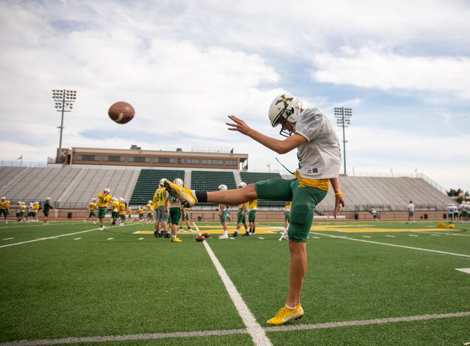 Jeffrey Sexton takes some punting practice Tuesday, Sept. 24, 2019 in Louisville Ky. After graduation, Sexton will go on to kick for a new Tiger team next year, Princeton.