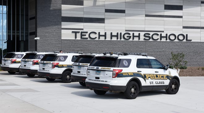 Squad cars are lined up outside of Tech High School Wednesday, Sept. 25, 2019. 