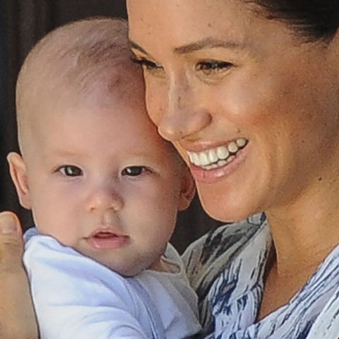 Duchess Meghan holds her baby son Archie as she an