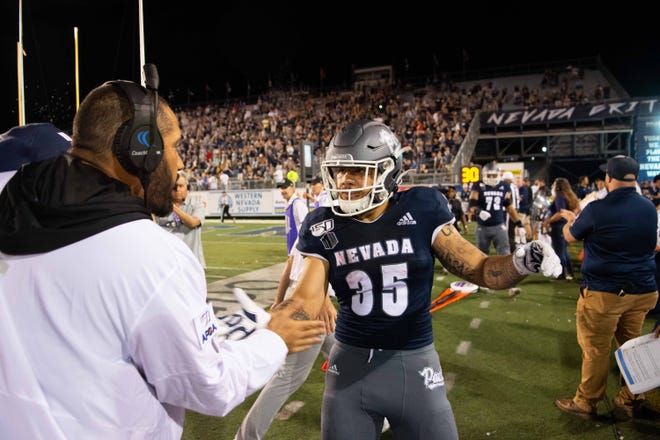 Nevada running back Toa Taua (35) celebrates after scoring a touchdown in the fourth quarter against Purdue.