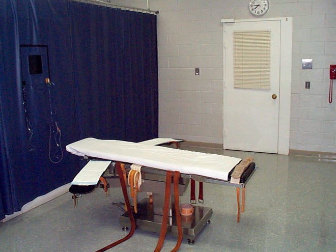 This undated file photo provided by the Virginia Department of Corrections shows the execution chamber at the Greensville Correctional Center in Jarratt. Prison officials are unconstitutionally limiting public access to executions in Virginia by blocking witnesses from seeing certain steps in the process, The News Leader and other news organizations allege in a federal lawsuit filed Monday.