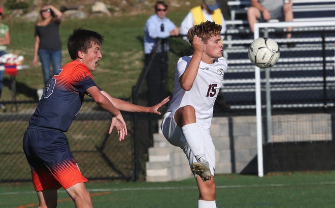From right, Ossining's Nolan Lenaghan (15) controls a pass in front of Horace Greeley's Owen Parsons (25) during boys soccer action at Horace Greeley High School in Chappaqua Sept. 25, 2019.  Greeley won the game 3-2.