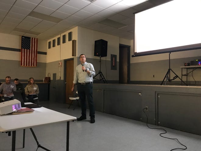Drew Gibbons, development director for Kansas-based Savion, talks to Saratoga residents about a proposed solar energy project planned for land currently owned by the Wysocki Family of Companies