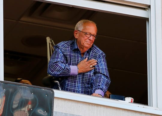 Retiring Reds broadcaster Marty Brennaman waves to a standing ovation as he prepares to call his final inning in the ninth inning of the MLB National League game between the Cincinnati Reds and the Milwaukee Brewers at Great American Ball Park in downtown Cincinnati on Thursday, Sept. 26, 2019. The Reds lost the final home game of the season, 5-3.