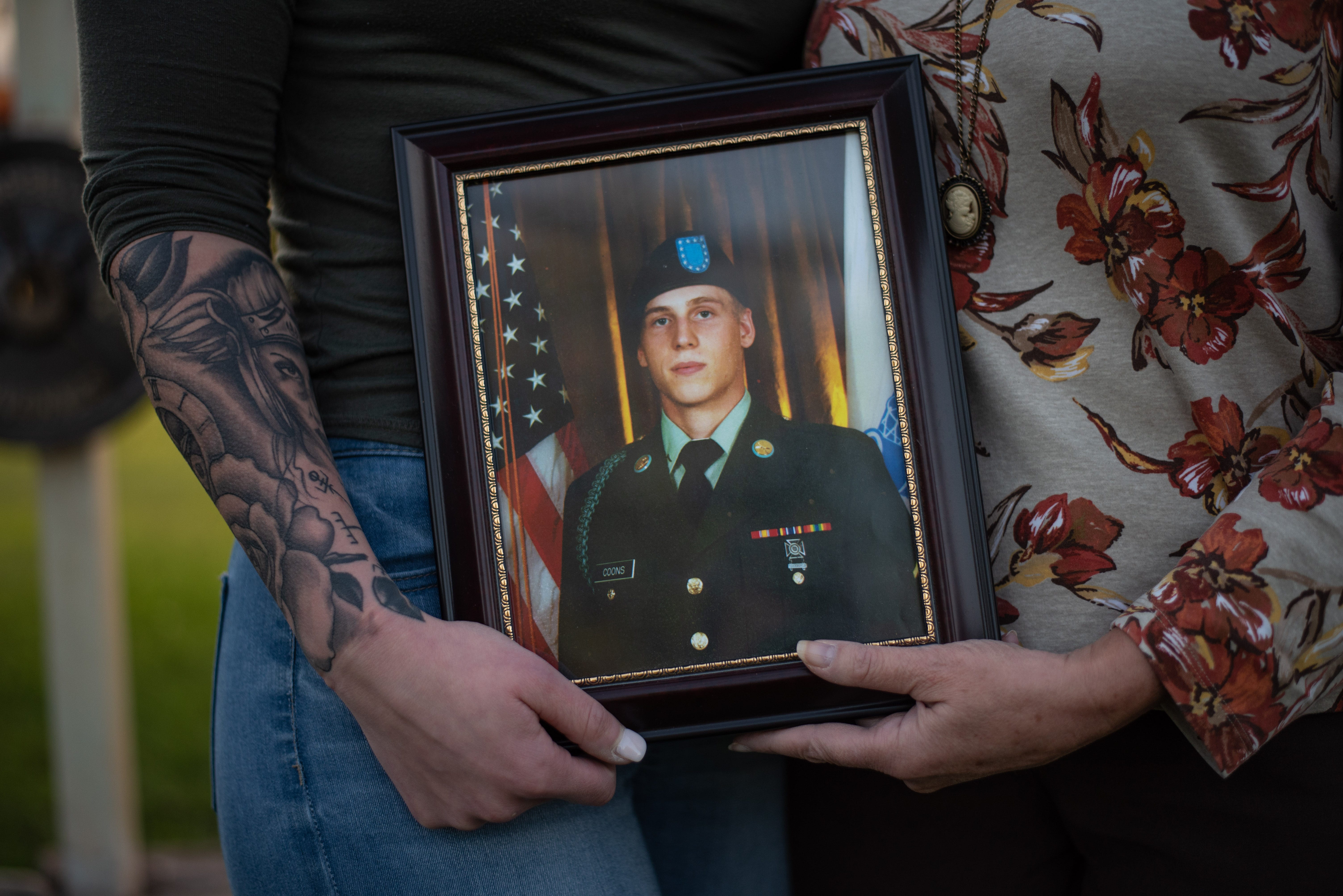 Ashleigh Coons, left, and her mom, Jill Richardson Perez, hold a photo of Matthew Coons while standing in Perez's front yard on Wednesday, Sept. 18, 2019. Matthew Coons was one of 20 people killed in the Oct. 6, 2018 limousine crash in Schoharie, New York.