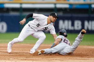 Chicago White Sox's Yolmer Sanchez, left, tags out at second base Detroit Tigers' Victor Reyes, right, during the third inning on Saturday.