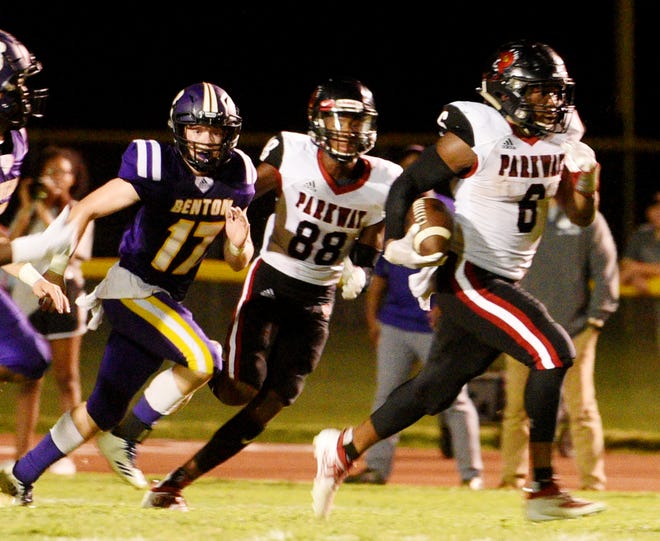 Parkway's Jamall Asberry pulls away from the Benton defense Friday night on the way to one of his five touchdowns.