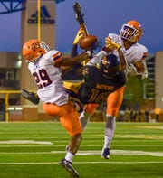 Southern Miss Golden Eagles wide receiver Quez Watkins tries to catch a pass to score a touchdown while UTEP Miners try to block Sept. 28, 2019.