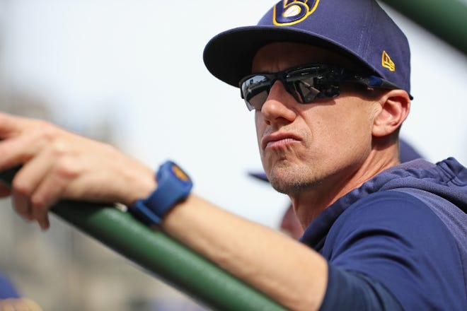 Brewers manager Craig Counsell watches as his team takes on the Chicago Cubs at Wrigley Field on Aug. 30.