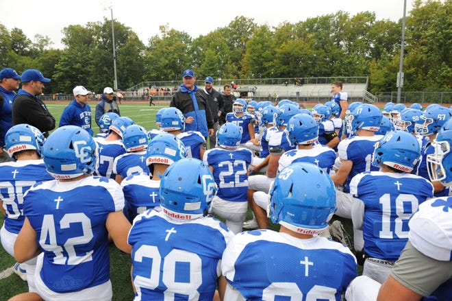 Detroit Catholic Central head coach Dan Anderson addresses his team after the Shamrocks defeat Brother Rice 7-3 on Sept. 29.