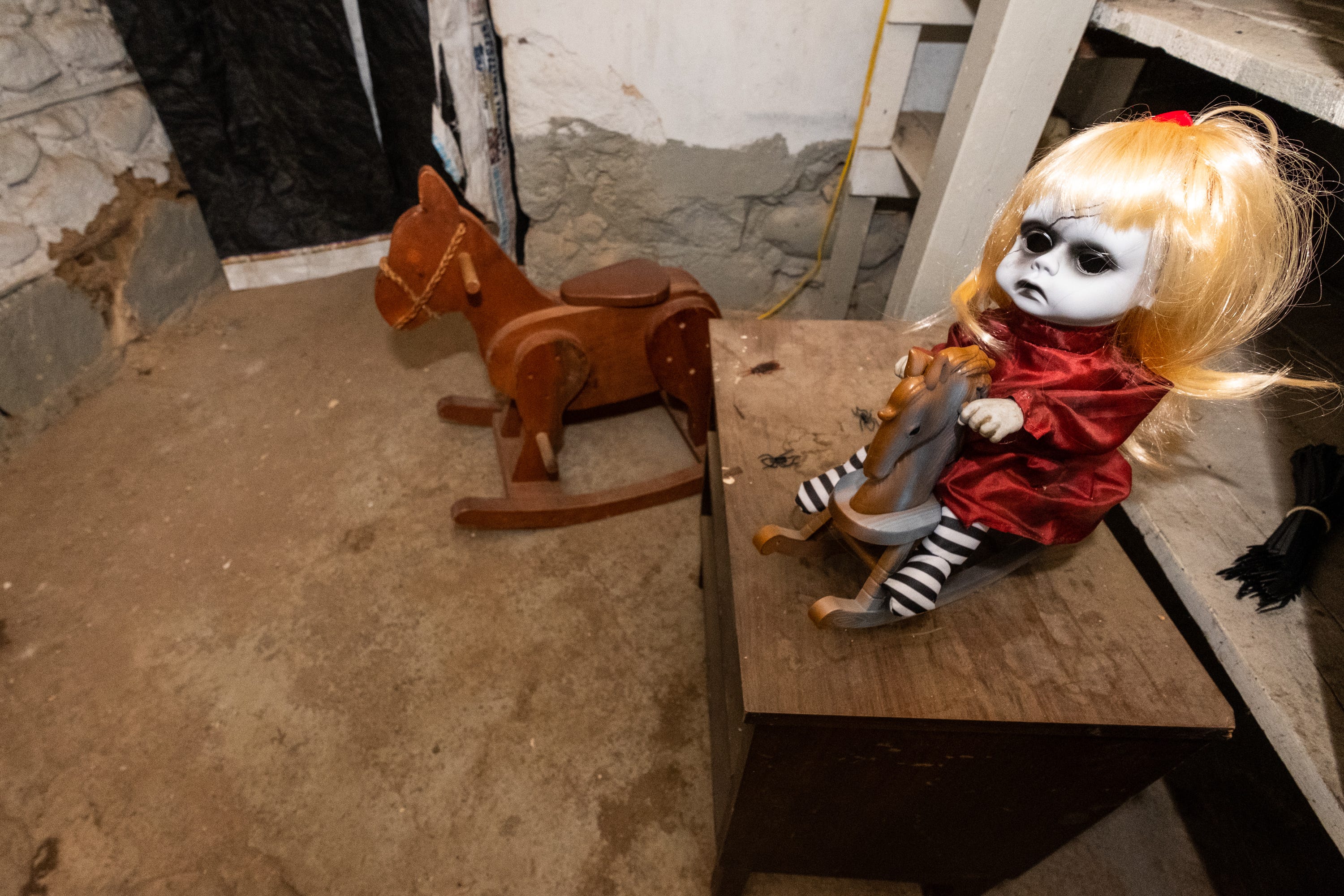 scary doll on rocking horse