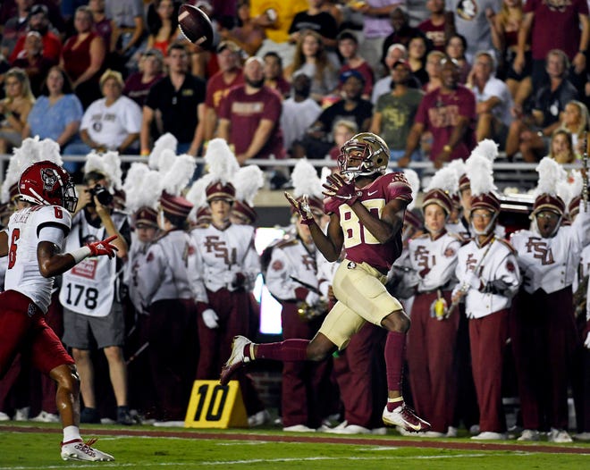 Sep 28, 2019; Tallahassee, FL, USA; Florida State Seminoles wide receiver Ontaria Wilson (80) catches a touchdown pass during the first half against the North Carolina State Wolfpack at Doak Campbell Stadium. Mandatory Credit: Melina Myers-USA TODAY Sports