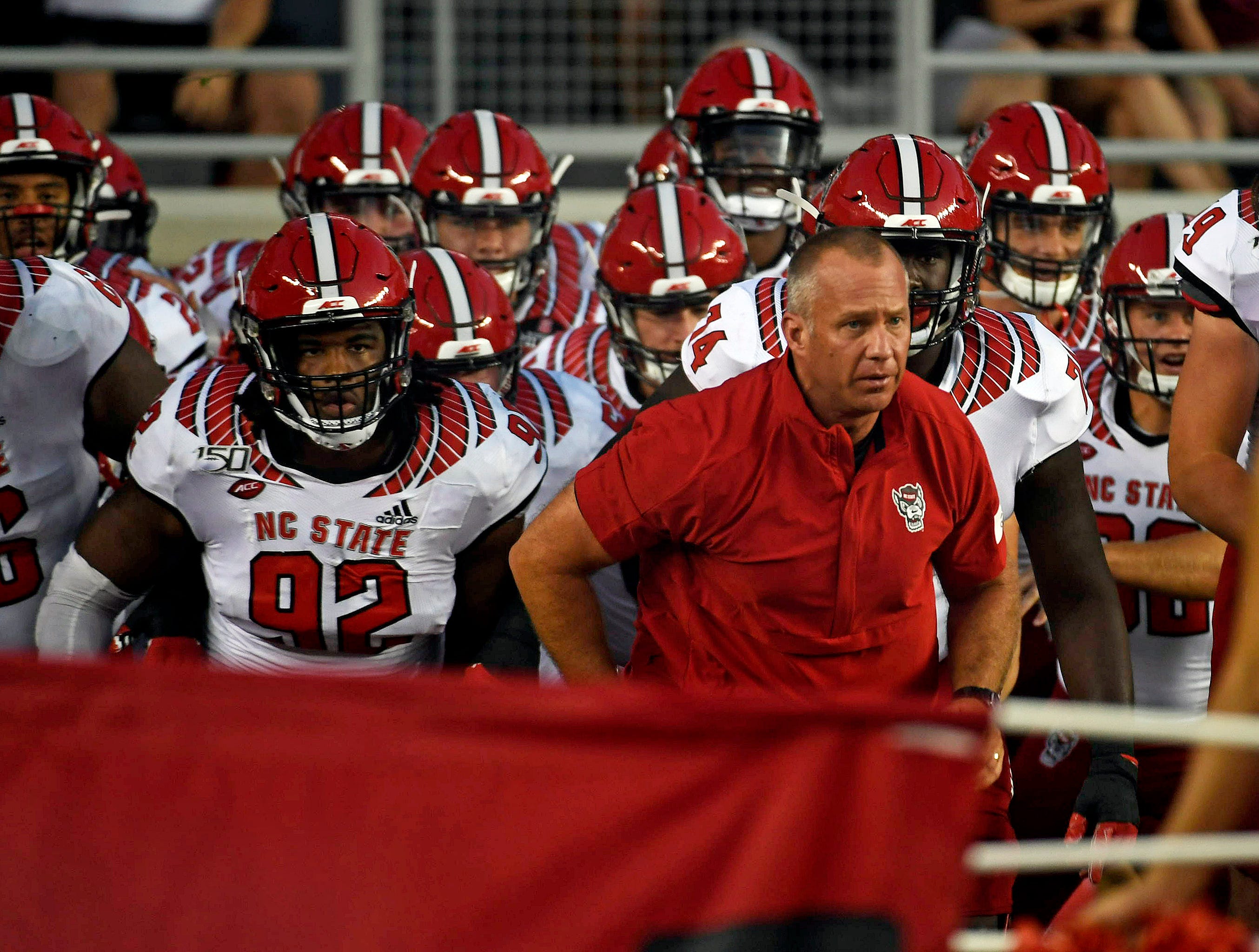 Sep 28, 2019; Tallahassee, FL, USA; North Carolina State Wolfpack head coach Dave Doeren with his team before the start of the game against the Florida State Seminoles at Doak Campbell Stadium. Mandatory Credit: Melina Myers-USA TODAY Sports