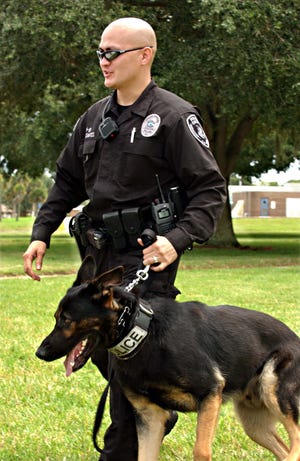 Cocoa police K-9 Timber and Officer Brian Delos-Santos on patrol in August 2008 when U.S. Sen. John McCain spoke at Brevard Community College-Cocoa.