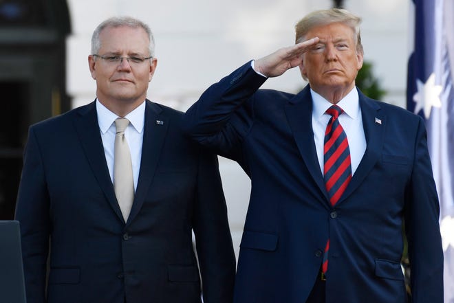 President Donald Trump and Australian Prime Minister Scott Morrison listen to the National Anthem during an State Arrival Ceremony on the South Lawn of the White House in Washington, Sept. 20.