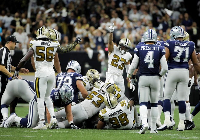 Sep 29, 2019; New Orleans, LA, USA; New Orleans Saints cornerback Marshon Lattimore (23) signals that the strong safety Vonn Bell (not pictured) recovered a fumble during the second quarter against the Dallas Cowboys at the Mercedes-Benz Superdome. Mandatory Credit: Derick E. Hingle-USA TODAY Sports