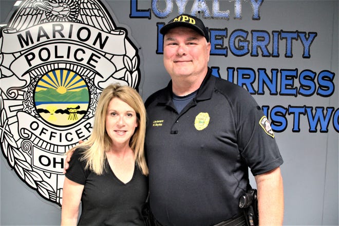 Lt. Matt Bayles, right, has retired from the Marion Police Department after spending 30 years working as a police officer. Bayles and his wife, Jennifer, were honored during a farewell party held on Friday, Sept. 27 at the department. He said his colleagues at MPD have been like family to him for the past three decades.