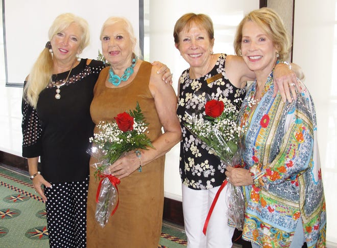 Rose Kraemer, president, with birthday girls, Marie Zoda, Linda Dolinger and Ann Faruol.
