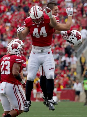 Wisconsin fullback John Chenal celebrates a touchdown against Michigan on Sept. 21. Chenal and Mason Stokke have combined to fill the shoes of Alec Ingold, who now plays in the NFL.