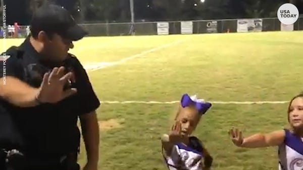 Police officer learns cheer routine from tiny chee