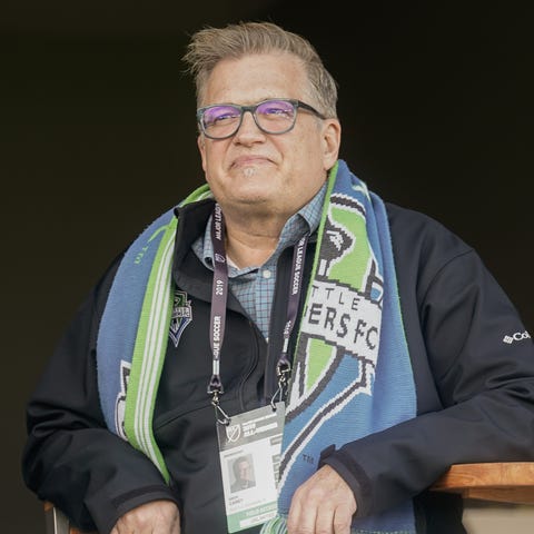 Drew Carey watches warmups before the match betwee
