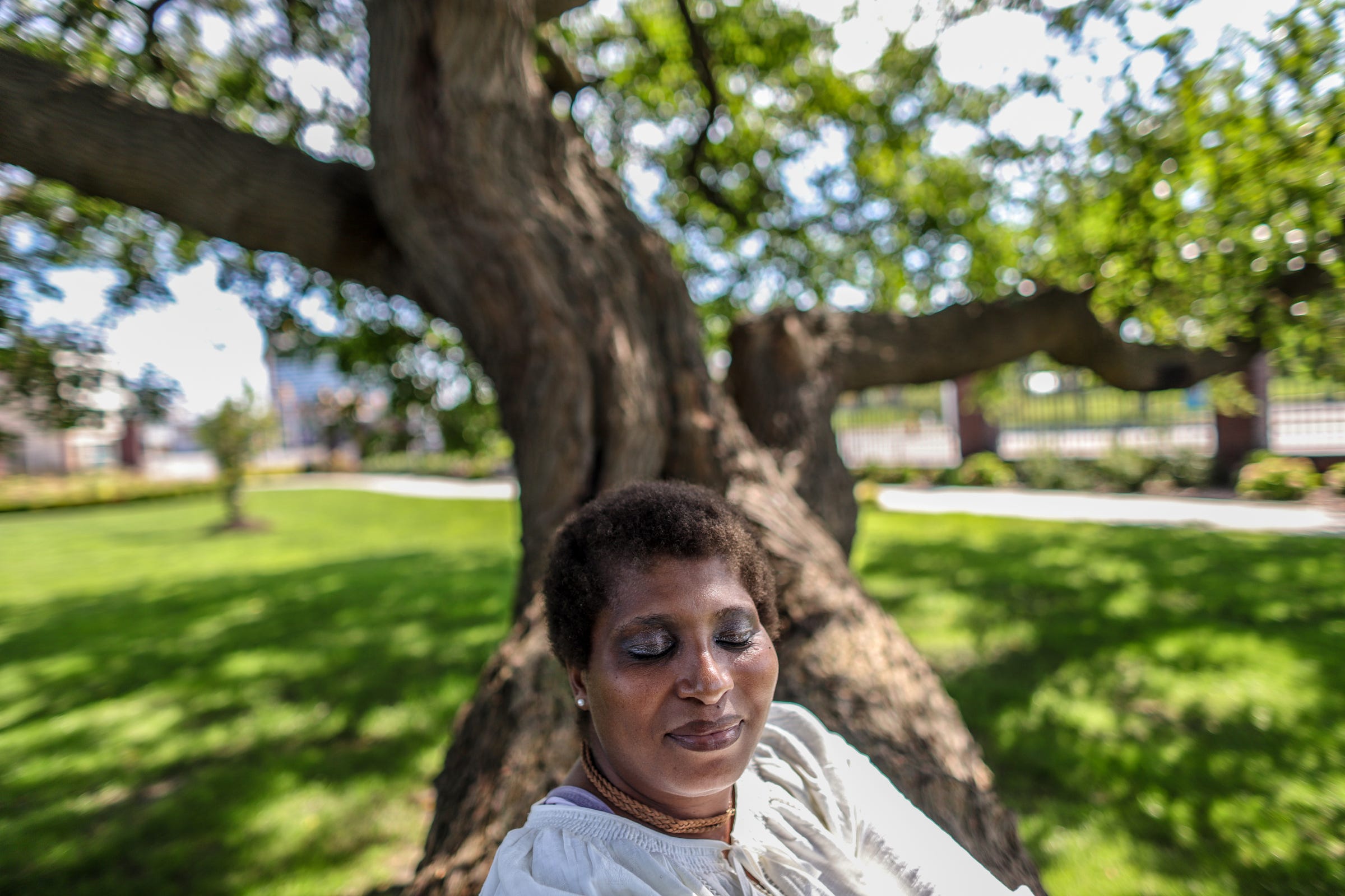 Kimberly Johnson, 45, of Detroit is enrolled in online classes at Ferris State University where she is getting a degree in Business Administration Operations Management and will owe more than $80,000 in student loans by the time she finishes. Johnson is photographed outside Douglass Branch Detroit Public Library in Scripps Park in Detroit on Tuesday, Sept. 17, 2019. Johnson, who works 48 hours a week, sometimes does her homework in the library.