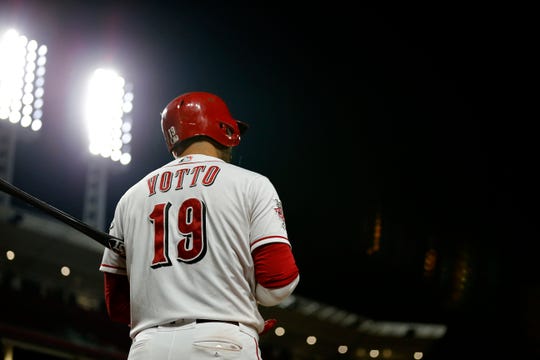 Cincinnati Reds first baseman Joey Votto (19) prepares in the on-deck circle in the ninth inning of the MLB National League game between the Cincinnati Reds and the Pittsburgh Pirates at Great American Ball Park in downtown Cincinnati on Tuesday, July 30, 2019. The Pirates won 11-4.