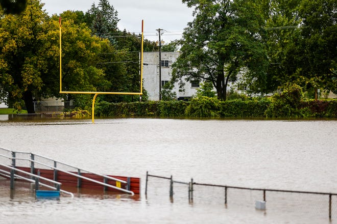 A goal post sticks up from flood waters Wednesday, Oct. 2, 2019, at Fruth Field in Fond du Lac, Wis. Several inches of rain fell over the area causing widespread flooding issues.