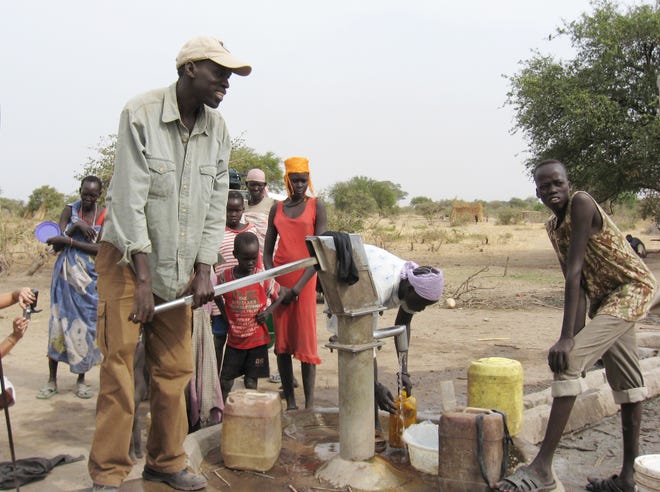 Salva Dut at water pump. Photo supplied by Water for South Sudan