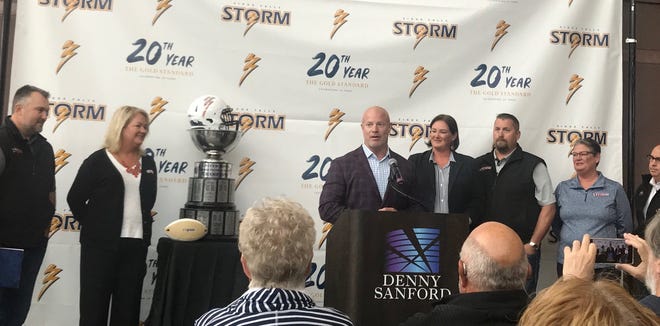 Todd Tryon (center) speaks to the media after announcing the sale of the Sioux Falls Storm to (from left) Jason Headlee, Valerie Headlee, Amber Garry, Patrick Garry, Stephanie Richter and David Richter.