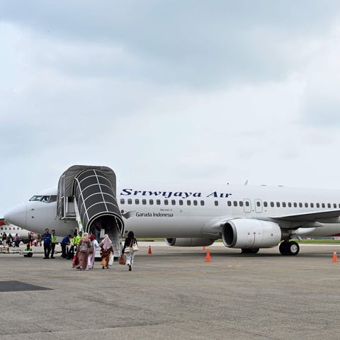 Passengers boarding a Sriwijaya Air Boeing 737-800