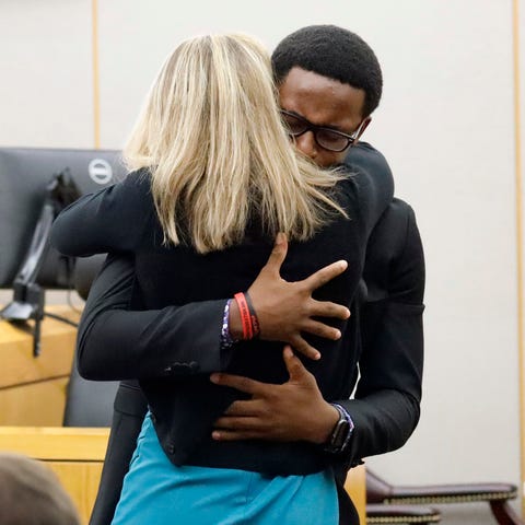 Botham Jean's younger brother Brandt hugs convicte