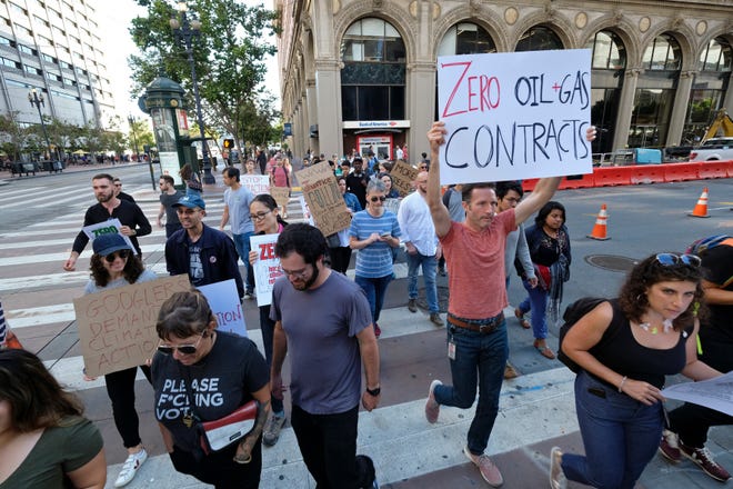 In this Friday, Sept. 20, 2019 file photo, Google employees make their way up Market Street to join others in a climate strike rally at City Hall, in San Francisco. Microsoft and other tech giants have been competing to strike lucrative partnerships with ExxonMobil, Chevron, Shell, BP and other energy firms.