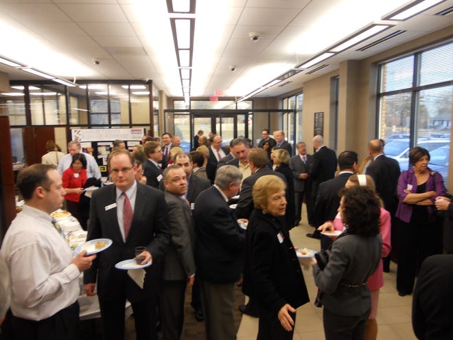 Business people gather at a recent networking event.