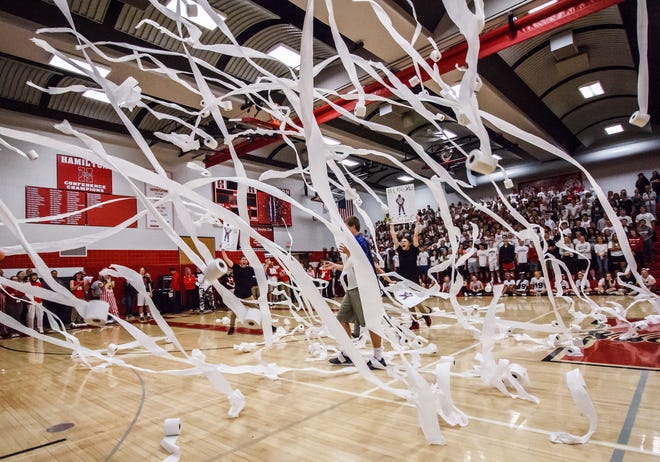 Toilet paper rains down from the senior section after the senior boys dance at Hamilton High School's homecoming pep rally in 2015. The school banned the dances after about a dozen male students engaged in inappropriate behavior during the skit in 2017. Two students have now started a petition to bring back the dances.