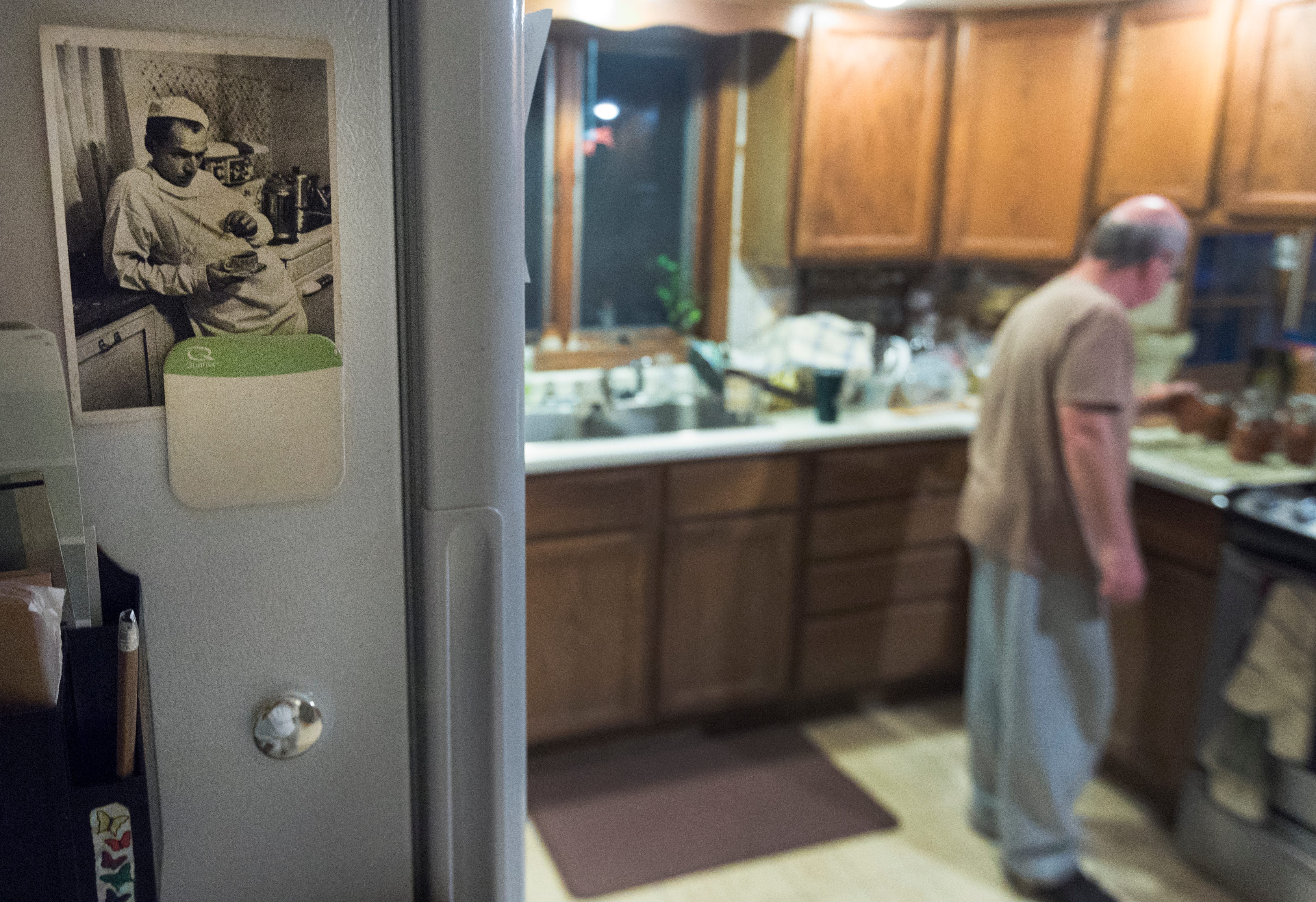 The photo of country doctor Ernest Guy Ceriani, made famous in a groundbreaking Life Magazine photo essay by W. Eugene Smith, hangs on James DeLine's refrigerator door at his home in La Farge.