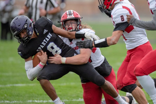Lakeshore senior Zeke Rohl (44) tackles Lakeview junior Jaden Simonson (8) on Friday, Oct. 4, 2019 at Lakeview High School in Battle Creek, Mich.