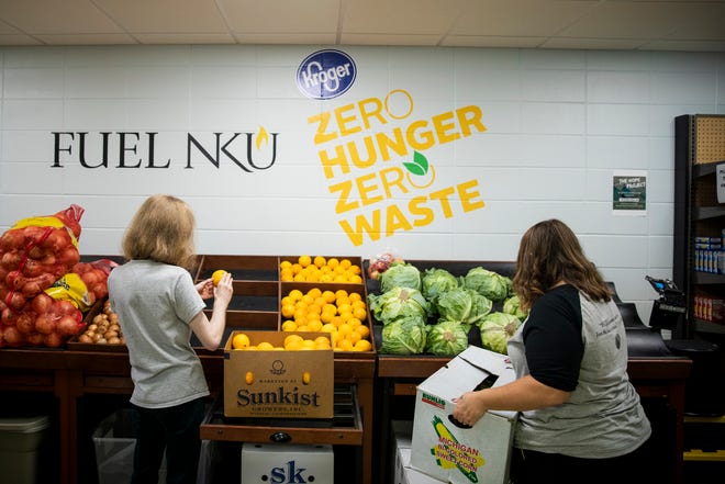 Valentine Peterson and Keyah Are restock produce at Fuel NKU, a food pantry at Northern Kentucky University Monday, September 30, 2019 in Highland Heights, Kentucky.