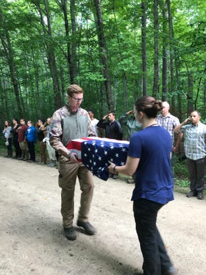 The Air Force Office of Special Investigations Cold Case Team and law enforcement partners depart the forest where Sgt. Donald Rexroth’s remains were recovered.