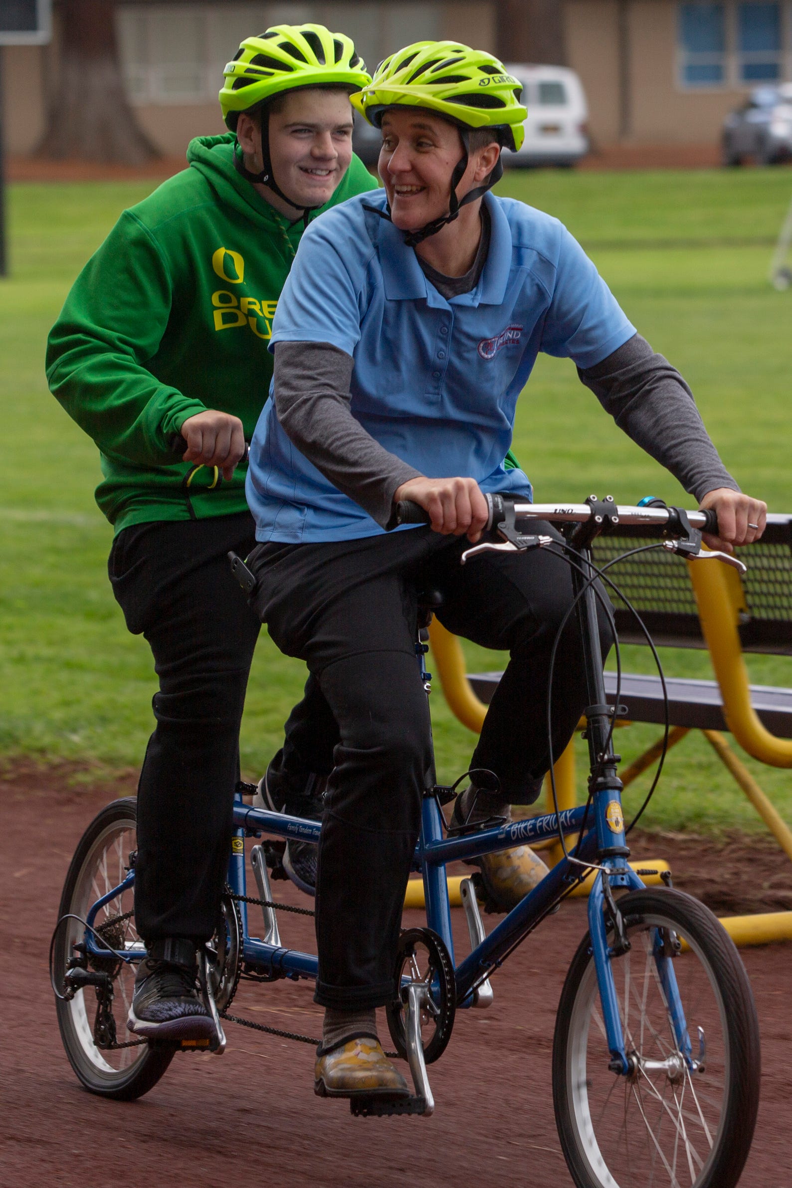 Tandem biking instructor Megan Ahleman and tenth-grader Jaden Kemper go for a spin at the Oregon School for the Deaf in Salem, Oct. 4, 2019. NWABA, the Northwest Association for Blind Athletes, hosted a "Paralympic experience" for students with visual impairments in the state. After the Oregon School for the Blind closed in 2009, many visually impaired students and their families lost access to state-funded resources, like sports programs. The BVIS (Blind Visually Impaired Student) Fund gives programs like NWABA funds to enhance the lives of low vision/blind children across the state.