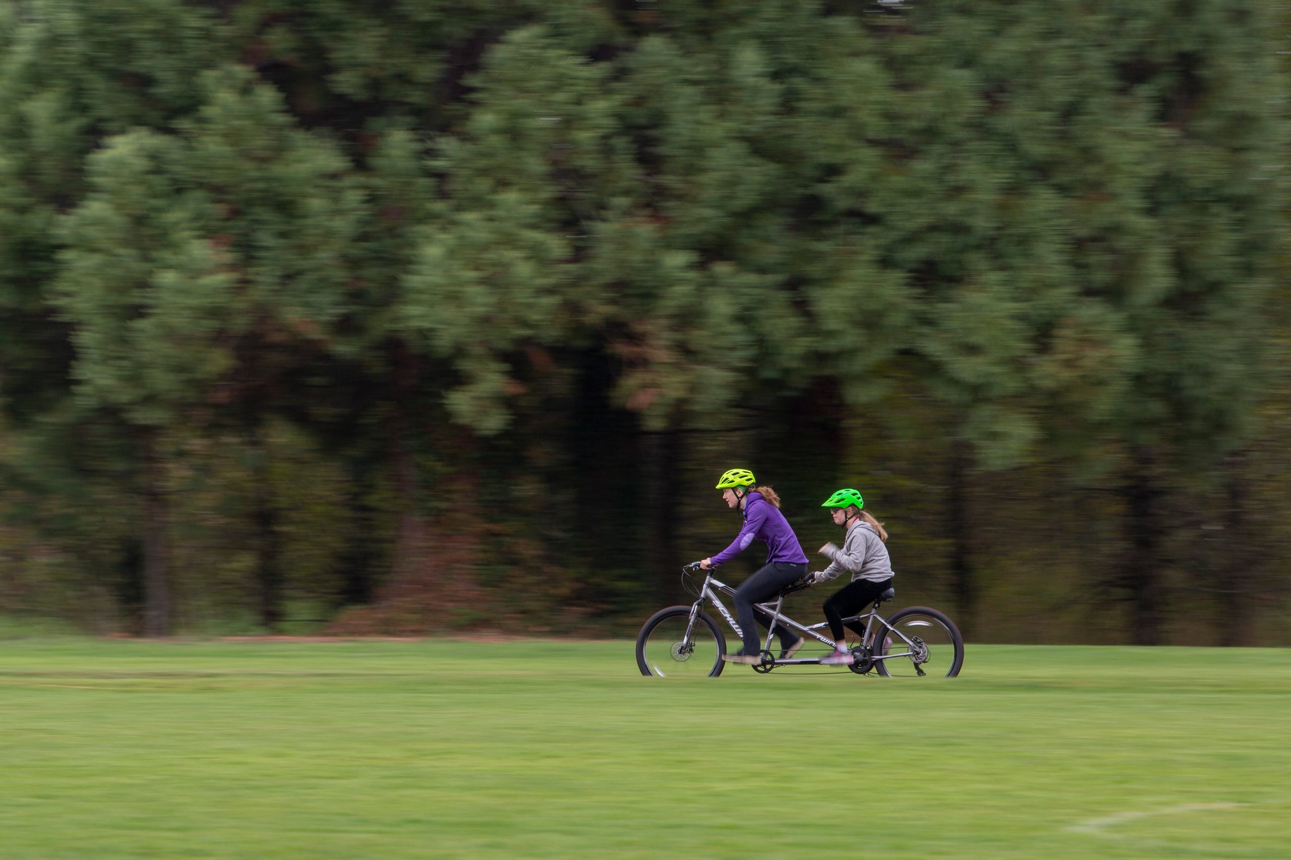 Tandem biking instructor JoJo Smyth and eighth-grader Adara Hale cycle together at the Oregon School for the Deaf in Salem, Oct. 4, 2019. NWABA, the Northwest Association for Blind Athletes, hosted a "Paralympic experience" for students with visual impairments in the state. After the Oregon School for the Blind closed in 2009, many visually impaired students and their families lost access to state-funded resources, like sports programs. The BVIS (Blind Visually Impaired Student) Fund gives programs like NWABA funds to enhance the lives of low vision/blind children across the state.