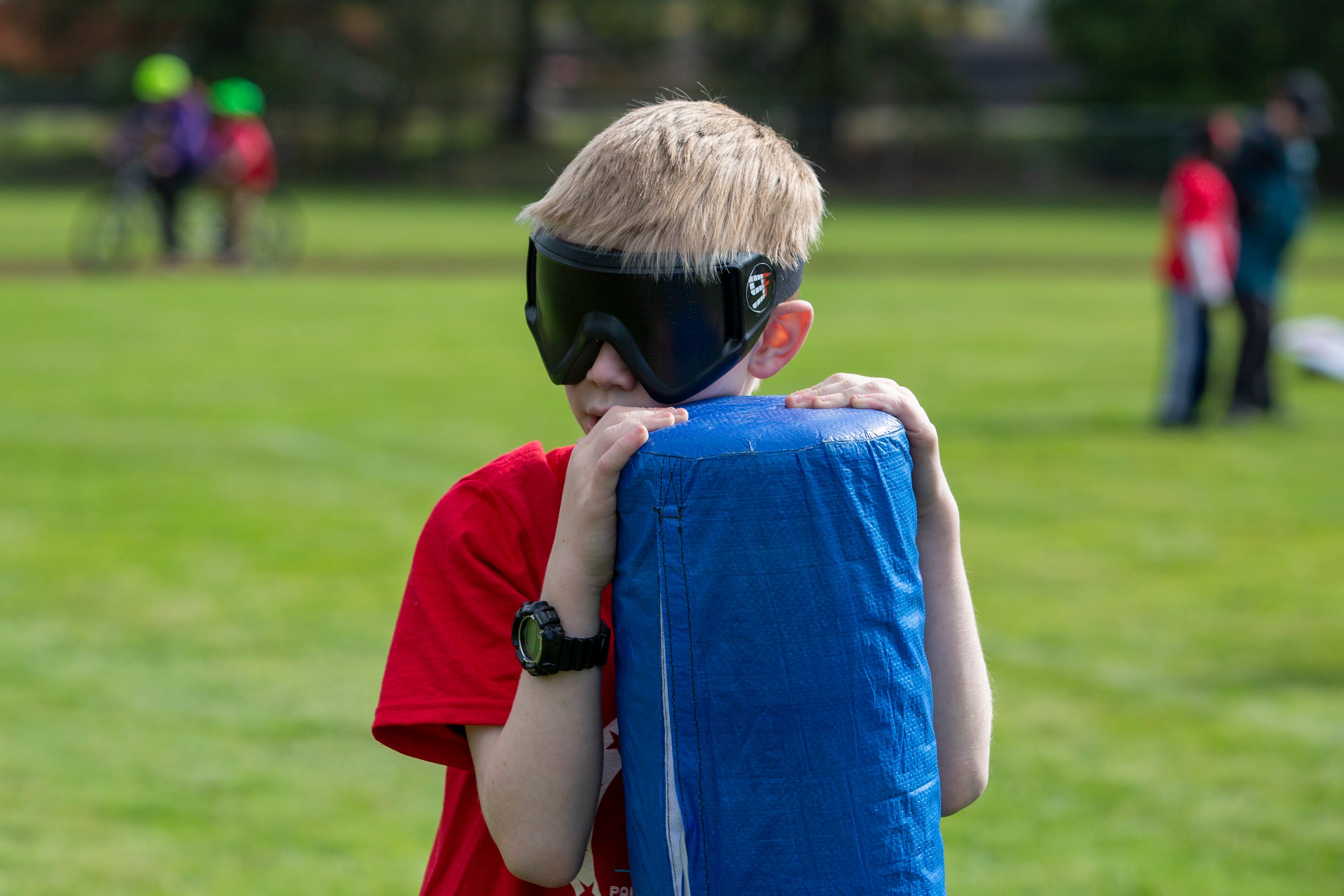 Peter Gault, a 6th grader, holds onto the base during beep kickball at the Oregon School for the Deaf in Salem, Oct. 4, 2019. NWABA, the Northwest Association for Blind Athletes, hosted a "Paralympic experience" for students with visual impairments in the state. After the Oregon School for the Blind closed in 2009, many visually impaired students and their families lost access to state-funded resources, like sports programs. The BVIS (Blind Visually Impaired Student) Fund gives programs like NWABA funds to enhance the lives of low vision/blind children across the state.