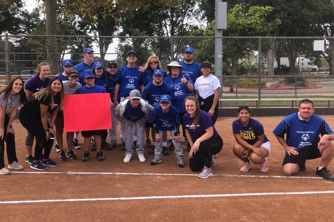 Cal Lutheran softball players, including senior slugger Kendall Marinesi (middle), held a clinic for Ventura County Special Olympians last week.