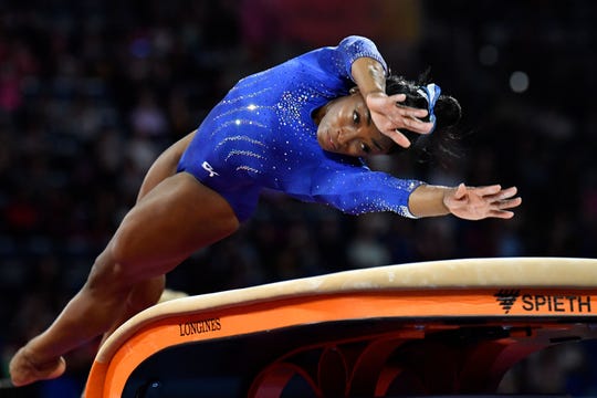 Simone Biles performs on the vault during a training session in preparation for the world championships in Germany.