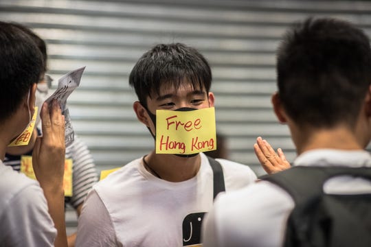 An activist takes part in a protest in Hong Kong, on Aug. 20, 2019.