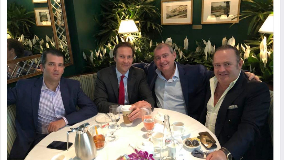 This Facebook screen shot provided by The Campaign Legal Center, shows from left, Donald Trump, Jr., Tommy Hicks, Jr., Lev Parnas and Igor Fruman, posted on May 21, 2018.