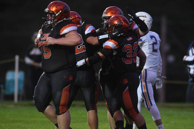 The Lucas Cubs flexed their muscles in a 58-7 win over Steubenville Central Catholic on Friday night.